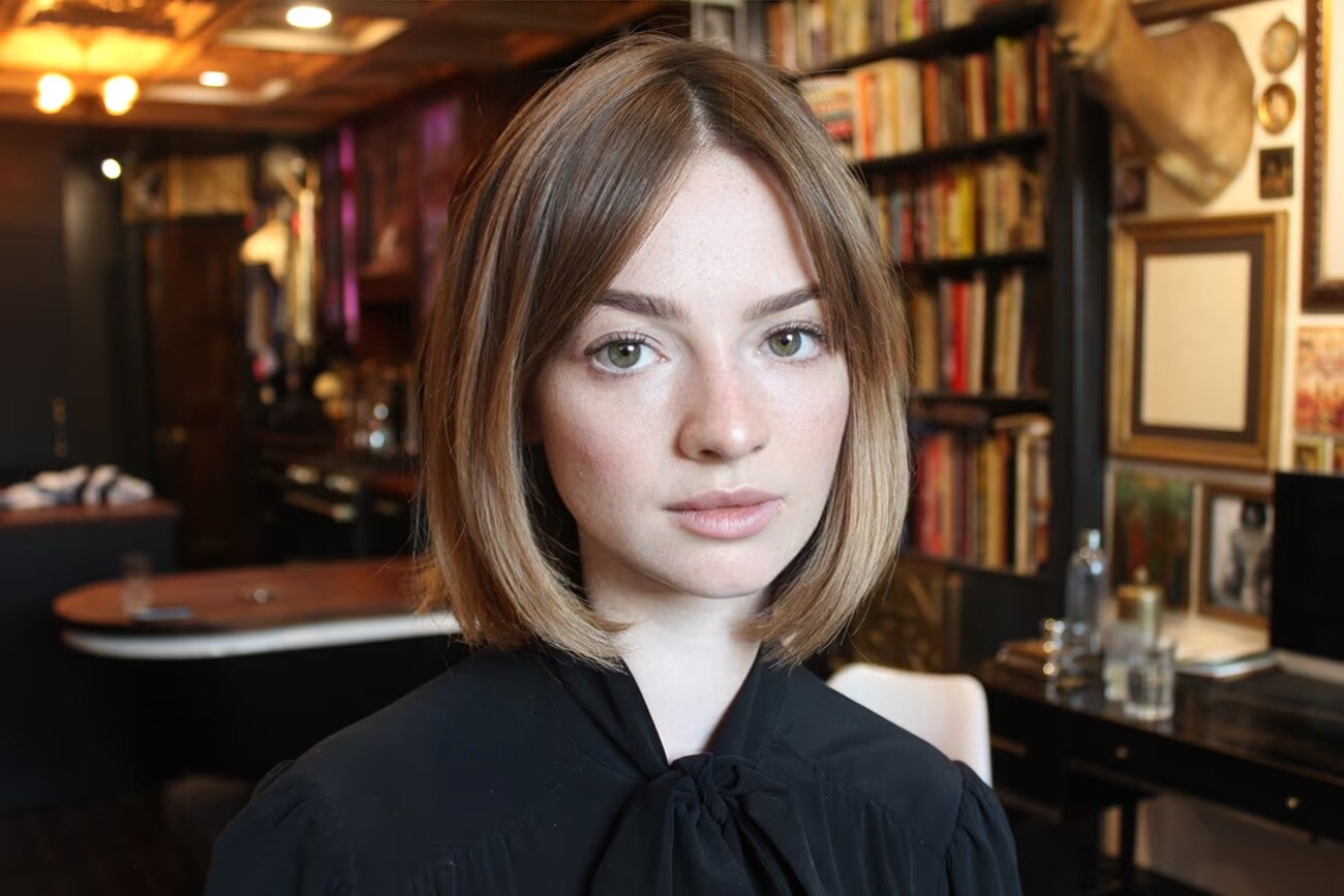 Close portrait of Madison Campbell in a warmly lit library