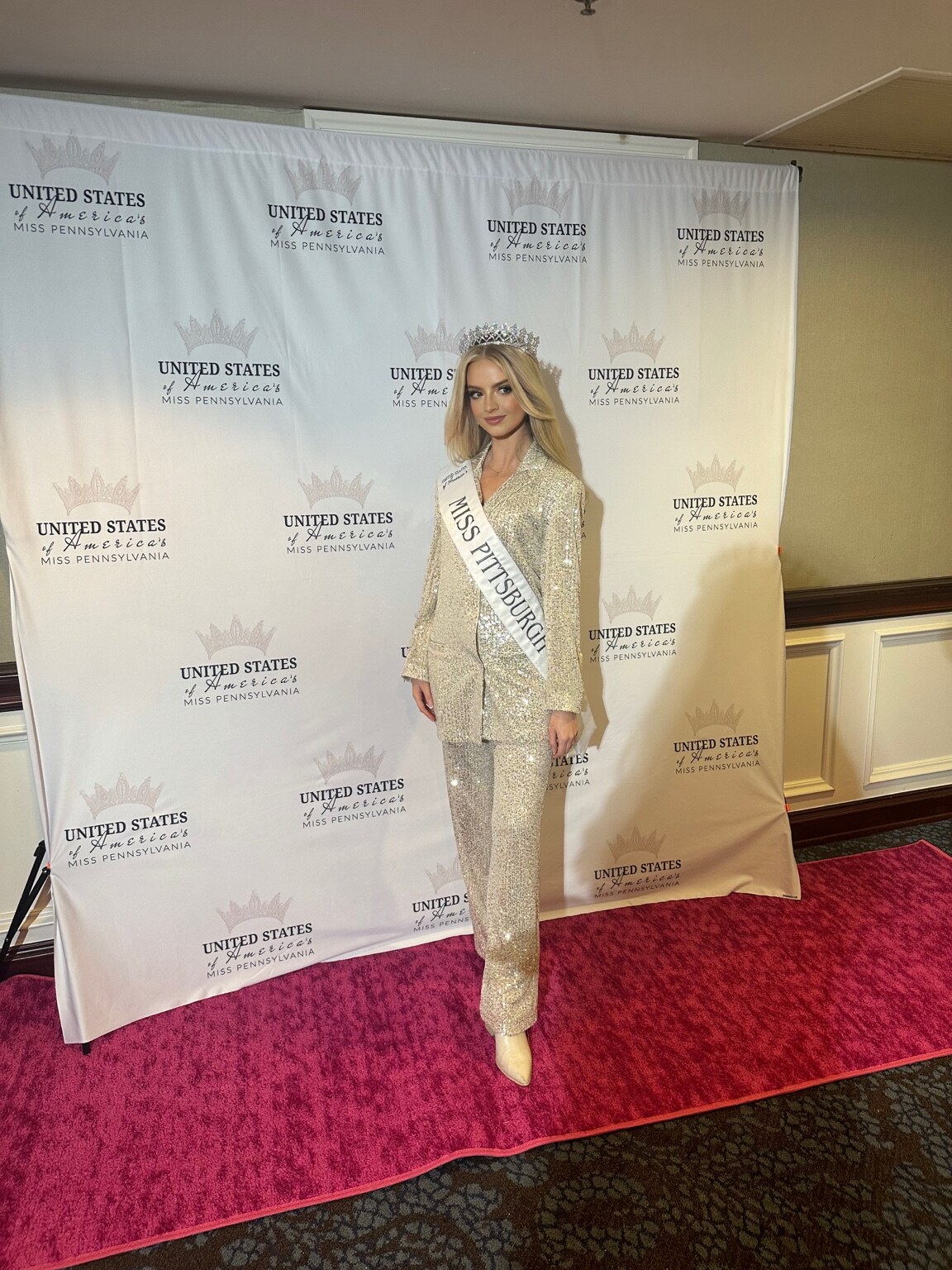 Full-length portrait of Madison Campbell in a gold outfit at a pageant event